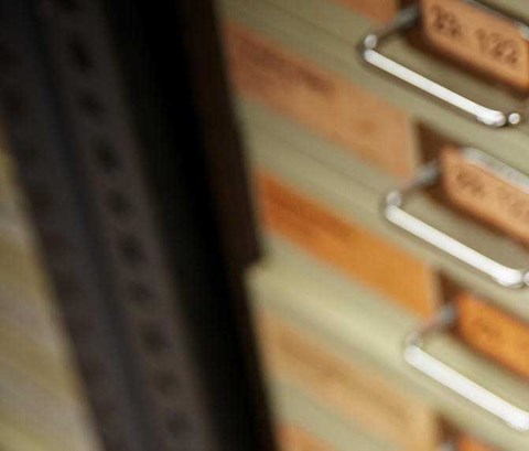 Close up of small drawers which hold Archaeology findings.